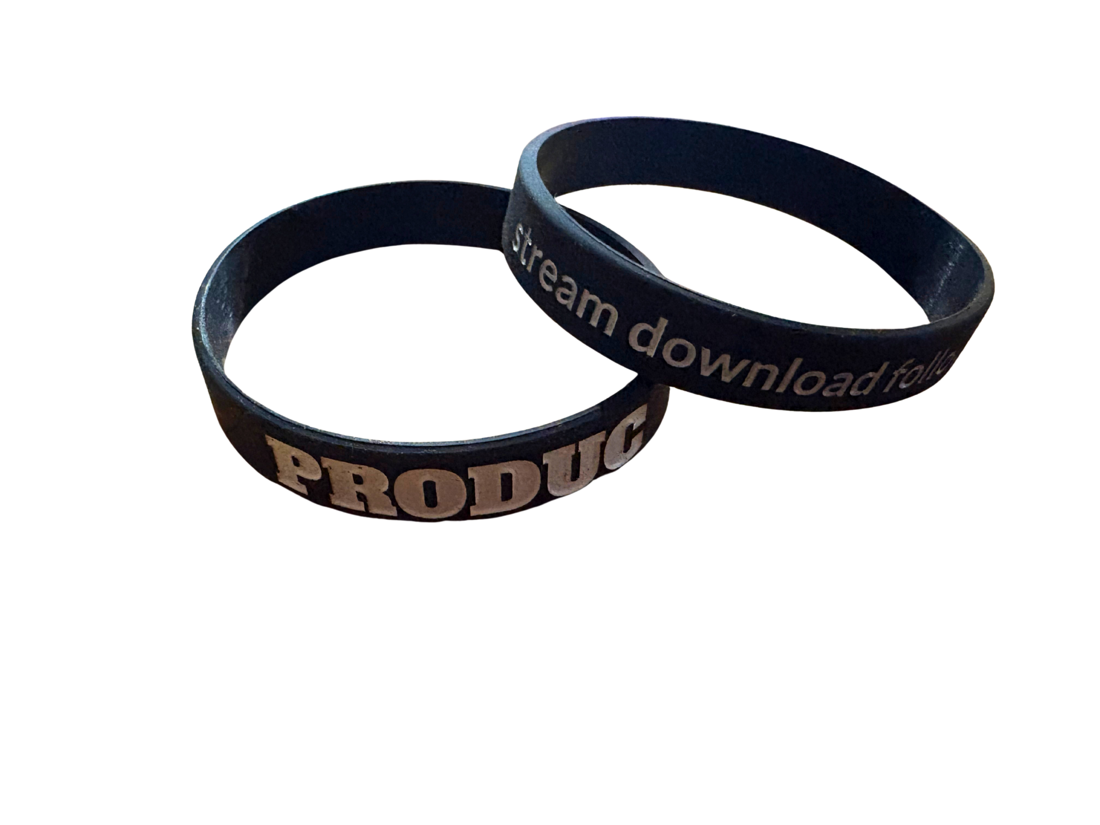 black silicone wristbands with gold text, one reading 'PRODCU' and the other 'stream download fa', shown on a plain white background.